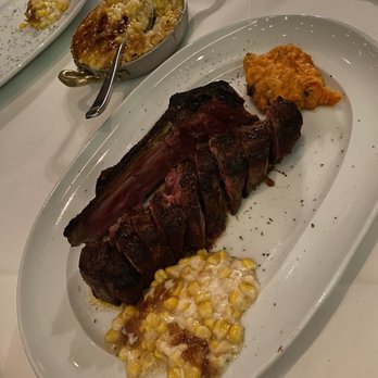 Steak 48 - KC strip, corn crème brulee, and whipped praline sweet potato on a hot plate. - Steakhouses Near Me - Beverly Hills, California
