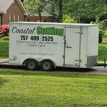 Coastal Cutting - a trailer parked in front of a house - Lawn Services Near Me Coastal Cutting - a trailer parked in front of a house - Lawn Services Near Me
