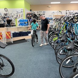 Excited to get on his new bike. Excited to get on his new bike.