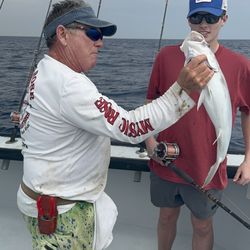 Mystic Rose Fishing Charters - Capt Marc holding a rudderfish.