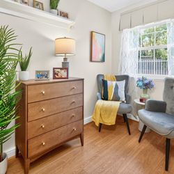 Artis Senior Living of Mason - Natural light-filled memory care suite with private bath and space for comfortable seating, dresser, and personal touches.