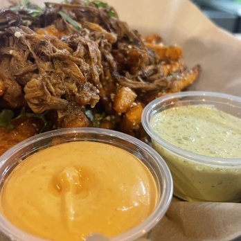 La Plancha - A cheese sauce and green sauce on the Side French Fries - Mexican Near Me - Austin, Texas