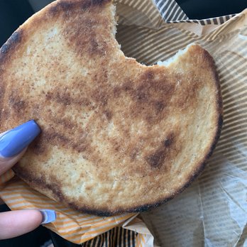 CAVA - Burnt/dry pita bread (ignore my huge bite I was excited) - Mediterranean Near Me - Irvine, California CAVA - Burnt/dry pita bread (ignore my huge bite I was excited) - Mediterranean Near Me - Irvine, California