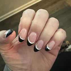 Diamond Nails And Spa - Almond Shaped acryllic nails with black and white polished tips.
