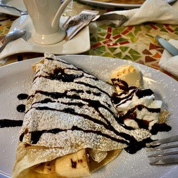 Cafe Veneto - Nutella banana crepes with light powdered sugar, drizzled chocolate syrup and a tiny scoop of vanilla icecream - Breakfast & Brunch Near Me - Jacksonville, Florida
