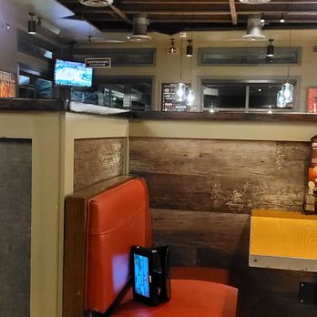 Chili's - a red chair in a restaurant - Bars Near Me - Flowery Branch, Georgia
