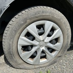 Kal Tire - My flat tire on the side of TransCanada Highway 1 outside Cache Creek, British Columbia.