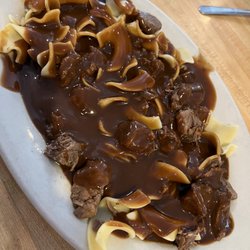 B & B Family Diner - Beef tips over noodles.