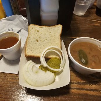Cooper's Old Time Pit Bar-B-Que - Free sides: sauce, onion, pickles, bread (two types), and pinto beans with bacon and jalapenos - Barbeque Near Me - Austin, Texas