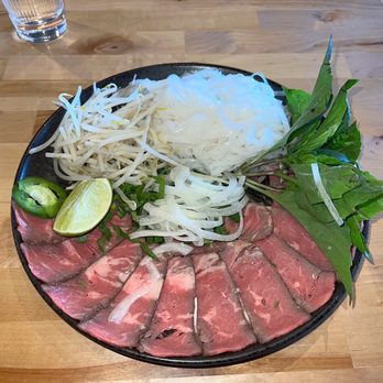 Pho Towda - Stone Bowl Signature Pho: rare beef steak and veggies - Vietnamese Near Me - Fairfax, Virginia Pho Towda - Stone Bowl Signature Pho: rare beef steak and veggies - Vietnamese Near Me - Fairfax, Virginia