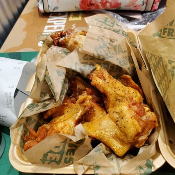 Wingstop - a bag of chicken wings on a table - Chicken Wings Near Me - Alhambra, California