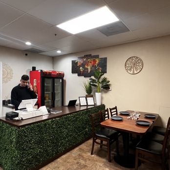 Namo Indian Cuisine - a man at the counter - Indian Near Me - Danville, California Namo Indian Cuisine - a man at the counter - Indian Near Me - Danville, California