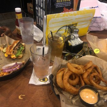 Buffalo Wild Wings - The burger is a cheese curo bacon burger , basket of onion rings drinks are knockout punch and Long Island - Chicken Wings Near Me - Orange, California