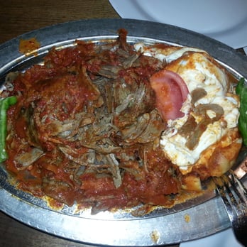 Mustafa Turkish Pizza - This dish called Iskandar .  All smoked beef with some spicy sauce, tomatoes, fried diced bread chunks, greek style yogurt.  $20 - Turkish Near Me - Toronto, Ontario