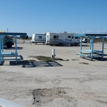 Padre Balli Park - An RV parks on each side of the picnic tables sandwiching them in the middle. - RV Parks Near Me - Corpus Christi, Texas Padre Balli Park - An RV parks on each side of the picnic tables sandwiching them in the middle. - RV Parks Near Me - Corpus Christi, Texas