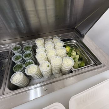 Mercado Davis - Onions, cilantro and limes in the salsa bar - Grocery Near Me - Davis, California