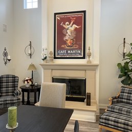Two plaid chairs and ottoman.