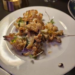 1/2 of the new charred cauliflower appetizer ... has lemon oil and labneh