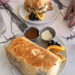 Breakfast sandwich and veggie burrito Breakfast sandwich and veggie burrito