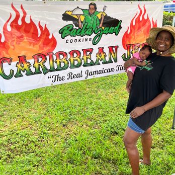 Backayaad Cooking and More - a woman holding a child - Food Trucks Near Me - Margate, Florida Backayaad Cooking and More - a woman holding a child - Food Trucks Near Me - Margate, Florida