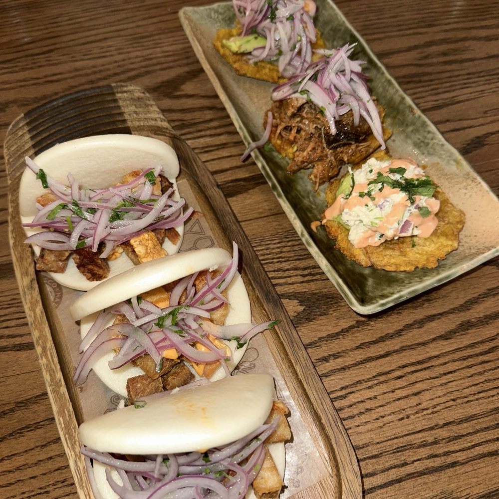Pork belly bao bun and tostones sampler Pork belly bao bun and tostones sampler