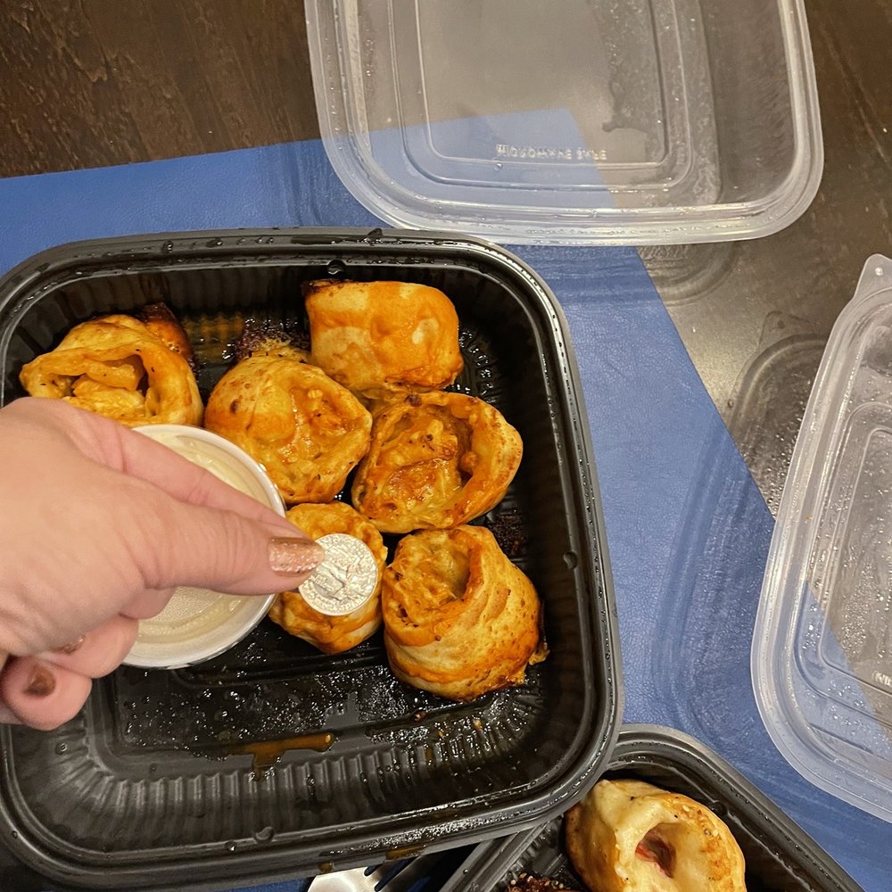 Old Chicago Pizza + Taproom - a person putting something in a container - Pizza Near Me - WICHITA, Kansas Old Chicago Pizza + Taproom - a person putting something in a container - Pizza Near Me - WICHITA, Kansas