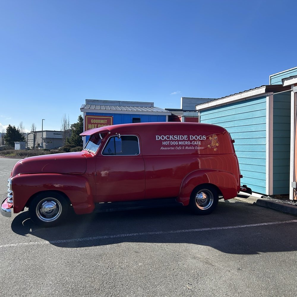 Dockside Dogs - a red truck parked in a parking lot - Hot Dogs Near Me - Anacortes, Washington