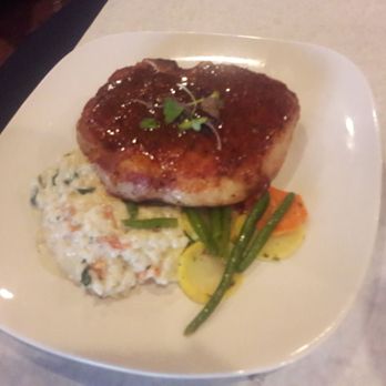 Vintage On 5th - Pork Porterhouse with mixed vegetables & sundried tomato risotto - New American Near Me - Crystal River, Florida Vintage On 5th - Pork Porterhouse with mixed vegetables & sundried tomato risotto - New American Near Me - Crystal River, Florida
