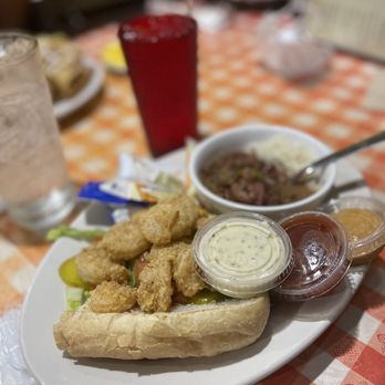 Daisy Mae’s - 1/2 Shrimp Po'Boy w/ a Side & Drink Combo - Red Beans & Rice - Breakfast & Brunch Near Me - New Orleans, Louisiana Daisy Mae’s - 1/2 Shrimp Po'Boy w/ a Side & Drink Combo - Red Beans & Rice - Breakfast & Brunch Near Me - New Orleans, Louisiana