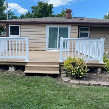 Milwaukee Renovations - the front of a home with a deck and a white railing - General Contractors Near Me Milwaukee Renovations - the front of a home with a deck and a white railing - General Contractors Near Me