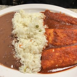El Cuscatleco - Chicken enchiladas with beans and rice.  She ordered hers dairy free.