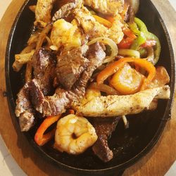 SIZZLING FAJITAS, SHRIMP, CHICKEN & BEEF