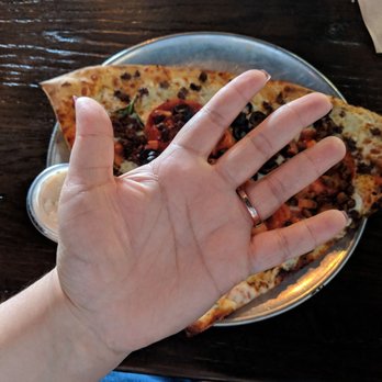 Lighthouse Pizza - This is a normal human hand with the pizza slice for reference. Come hungry!!! - Pizza Near Me - Omaha, Nebraska Lighthouse Pizza - This is a normal human hand with the pizza slice for reference. Come hungry!!! - Pizza Near Me - Omaha, Nebraska