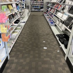 Officemax - Trash and heavily stained carpet throughout business.