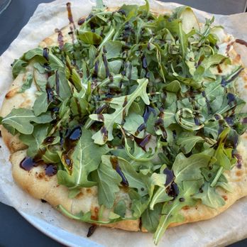 Limoncello - THE PEARFECT PEAR Caramelized onions, pears, roasted garlic, mozzarella, prosciut arugula, balsamic - Italian Near Me - Greenville, South Carolina
