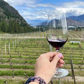 See Ya Later Ranch - a hand holding a glass of wine - Wineries Near Me - Okanagan Falls, British Columbia