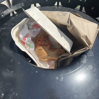 Cosa Nostra - Trash can with a 3/4 of a gross sandwich - Sandwiches Near Me - Clermont, Florida