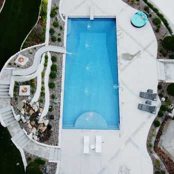 Swimming Pool Services - Full view of a new custom in-ground pool, featuring a slide, laminars, and more! - Pool Cleaners Near Me - Waukesha, Wisconsin Swimming Pool Services - Full view of a new custom in-ground pool, featuring a slide, laminars, and more! - Pool Cleaners Near Me - Waukesha, Wisconsin
