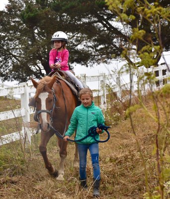Pony Rides - For your youngsters under 6 years of age we have a specially designed pony ride just for them. We utilize our gentlest horses and ponies equipped with saddles designed for little people. One of our wranglers carefully leads your youngster on horseback from the ground using a lead rope. The ride takes place in either the fenced arena or a small fenced pasture area. The ride lasts approximately fifteen to twenty minutes. Your youngster has a chance to get to know the horse which often leads to a lifelong admiration for horses as their friends. Pony Rides - For your youngsters under 6 years of age we have a specially designed pony ride just for them. We utilize our gentlest horses and ponies equipped with saddles designed for little people. One of our wranglers carefully leads your youngster on horseback from the ground using a lead rope. The ride takes place in either the fenced arena or a small fenced pasture area. The ride lasts approximately fifteen to twenty minutes. Your youngster has a chance to get to know the horse which often leads to a lifelong admiration for horses as their friends.