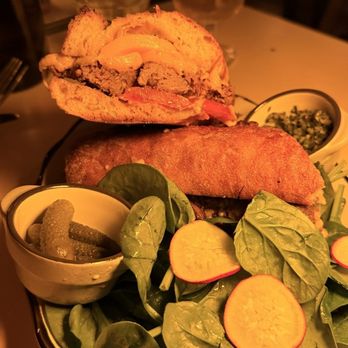 Beco - My world's best Brazilian filet mignon sandwich!! - A sandwich with a toasted bun, filled with meat and cheese, served with fresh spinach, radish slices, pickles, and sauces. - Brazilian Near Me - Brooklyn, New York