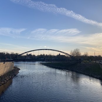 Phoenix Park - a view of a bridge over a river - Farmers Market Near Me - Eau Claire, Wisconsin