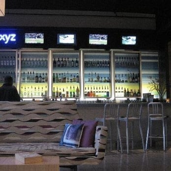 W XYZ Bar - a couch and chairs in front of a bar - Venues & Event Spaces Near Me - Tempe, Arizona W XYZ Bar - a couch and chairs in front of a bar - Venues & Event Spaces Near Me - Tempe, Arizona
