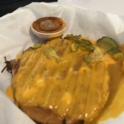 The Shed - Brisket Sammich covered in queso and pickles
