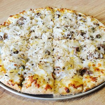 Boss' Pizza & Chicken - pizza on a pizza pan - Pizza Near Me - Fargo, North Dakota Boss' Pizza & Chicken - pizza on a pizza pan - Pizza Near Me - Fargo, North Dakota