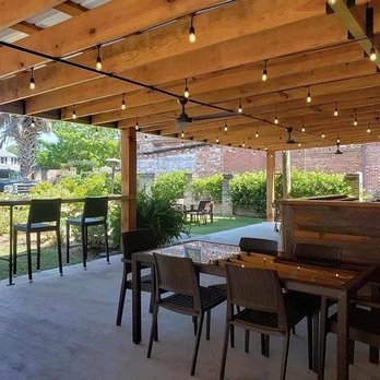 Bistro 221 - This is a photo of the outside. In the background you can see the pergola and grassy seating area. Great place to host a group. - American Near Me - Saint George, South Carolina