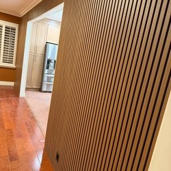 Ceiling high sound absorbing wooden slats