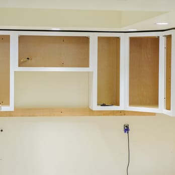 All Wood Cabinetry - Putting up the wall cabinets. We removed the doors to not damage them. - Cabinetry Near Me - Bartow, Florida All Wood Cabinetry - Putting up the wall cabinets. We removed the doors to not damage them. - Cabinetry Near Me - Bartow, Florida