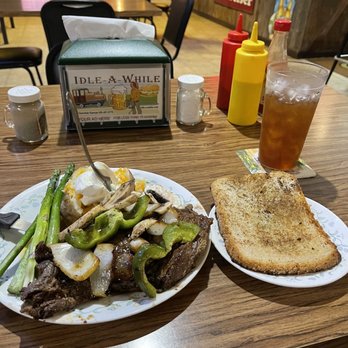 Idle-A-While - ows two plates of food on a table - Bars Near Me - Cherokee, Kansas