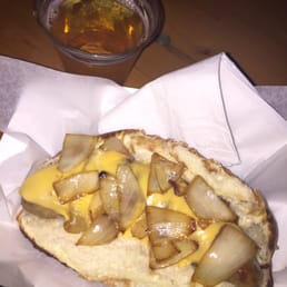 Bacon wrapped brat with cheddar cheese and onions! Bacon wrapped brat with cheddar cheese and onions!