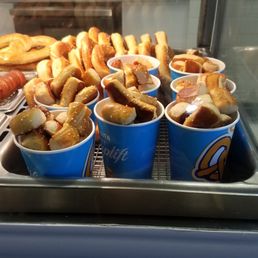 a display of hot dogs and french fries a display of hot dogs and french fries